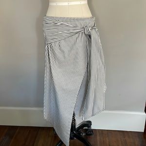 SIR. Asymmetrical wrap skirt. Blue and white strip with button and tie closure.